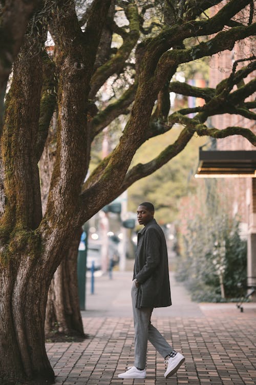 Ethnic man on paved sidewalk