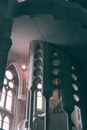 Low angle of old basilica Sagrada Familia located in Barcelona in Spain with arched windows and geometric elements on stairs in daylight