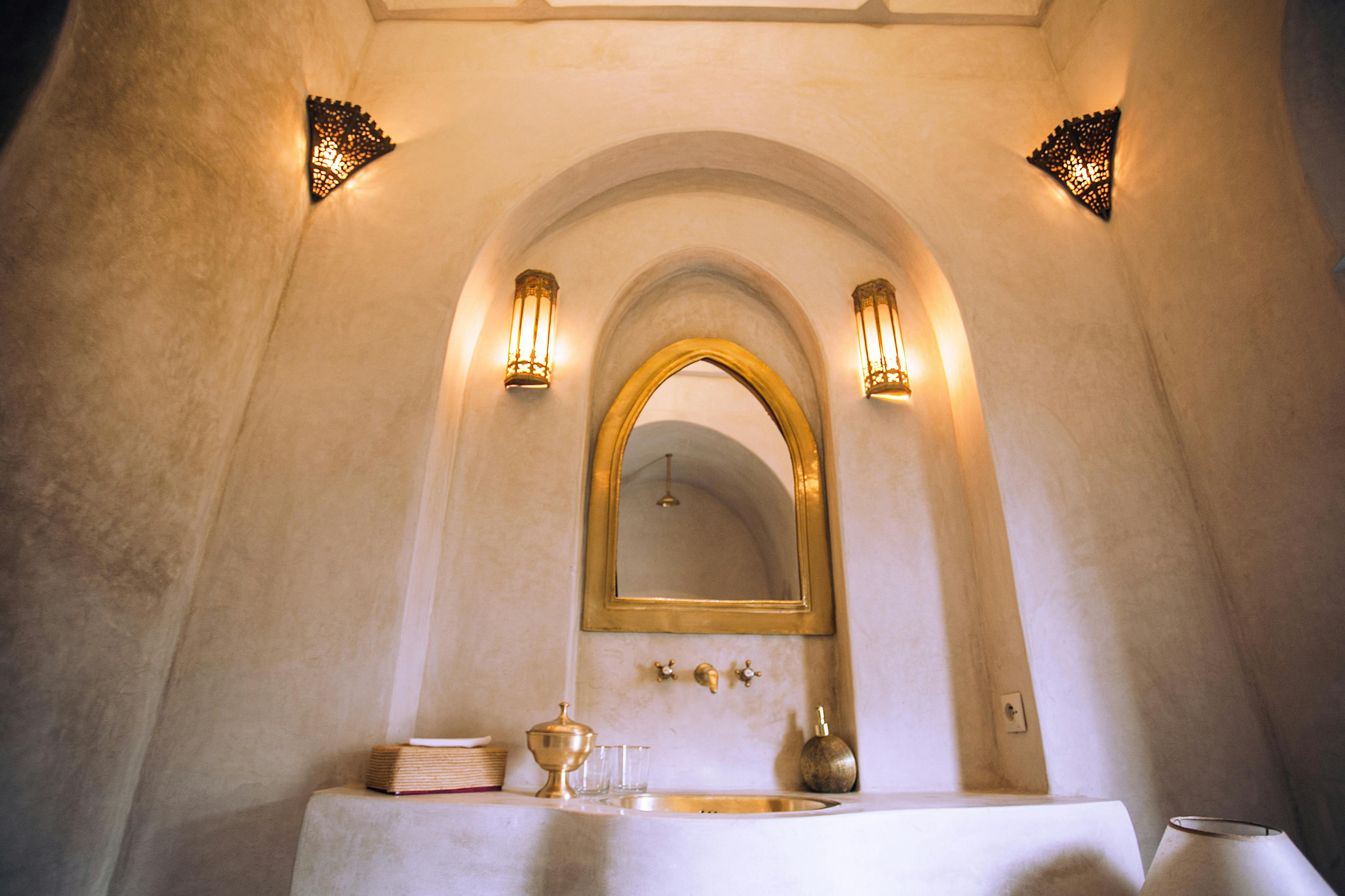 interior of spacious oriental bathroom with mirror