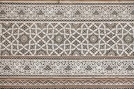 Carved ornament in wooden panel