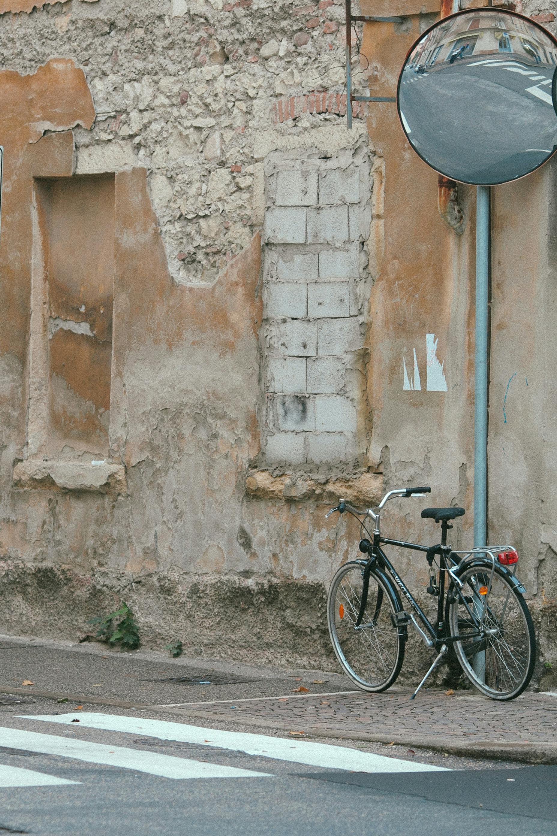 bicycle on pavement near wall