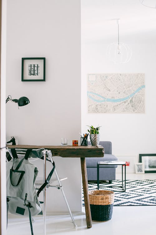 Interior of modern room with wooden table with lamp and chair as workplace