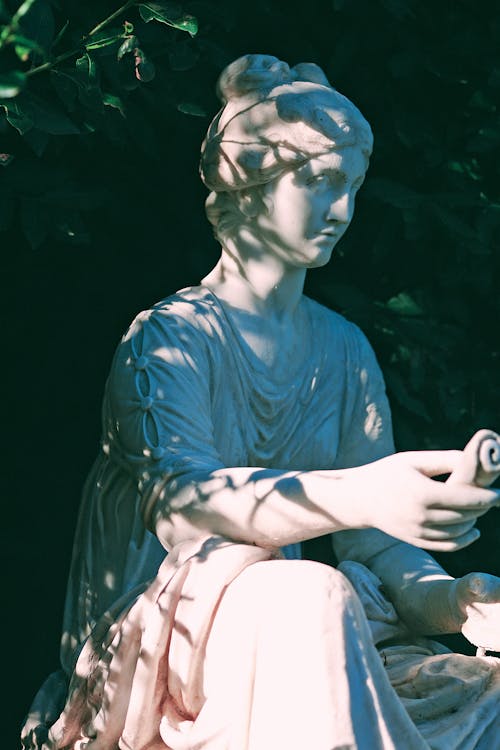 Statue of woman in shade