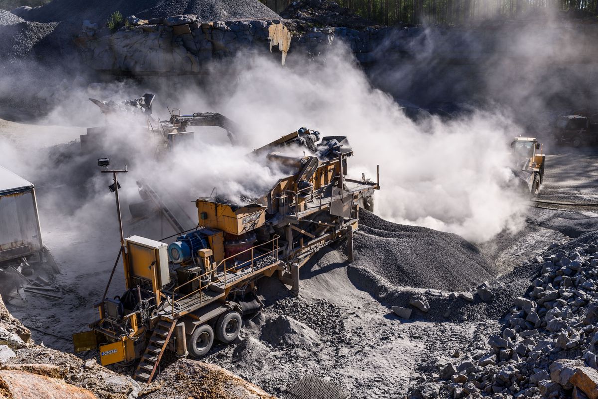 Mining engineer inspecting operations on site