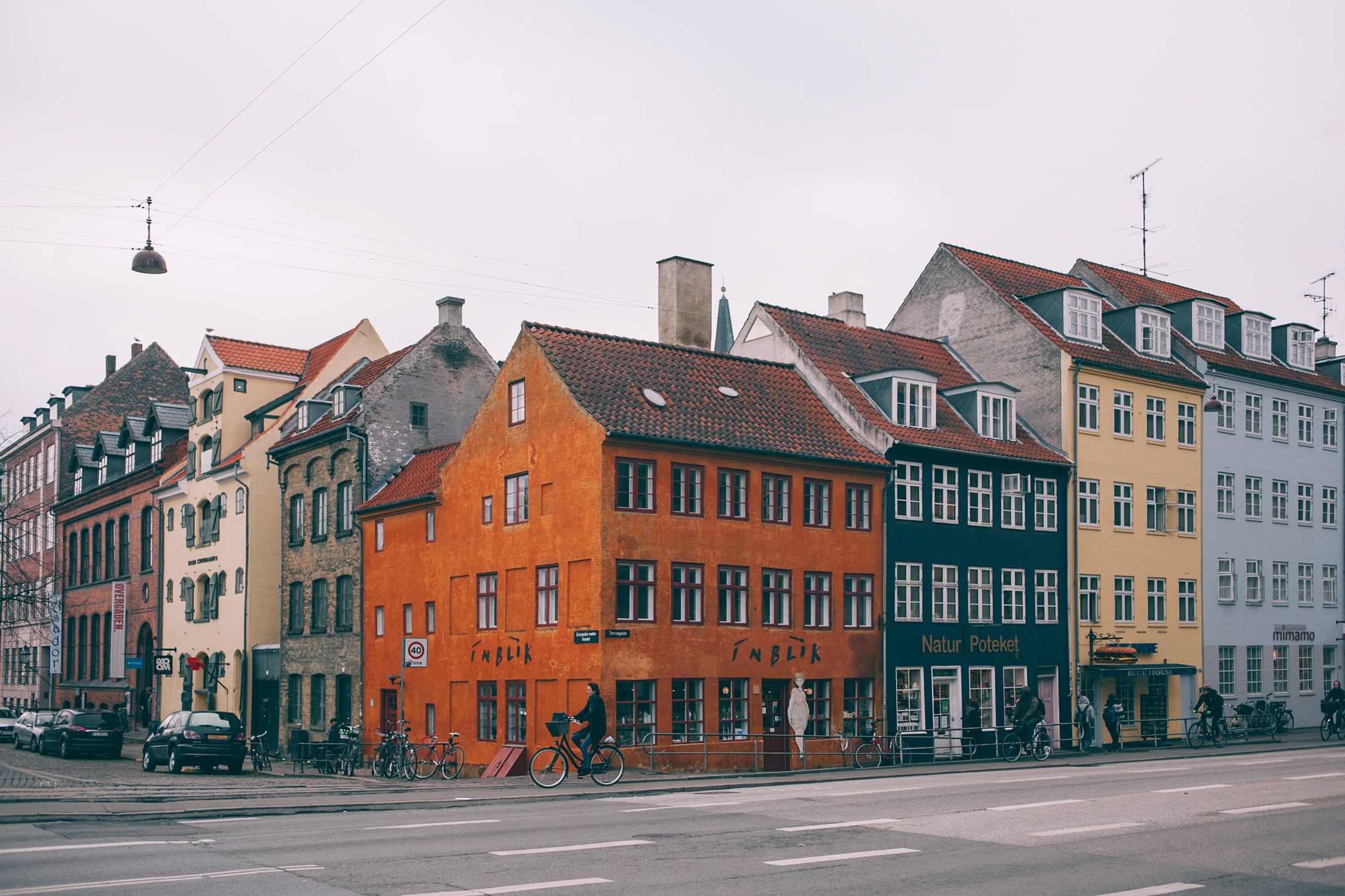 Scenic view of colorful historical buildings lining a street in Copenhagen