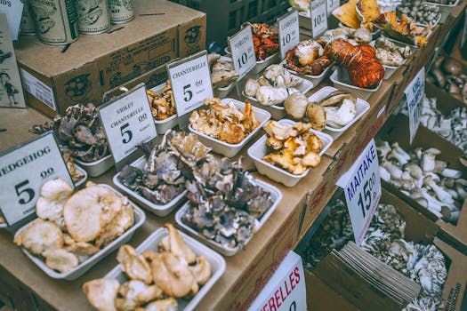 Explore a selection of organic mushrooms including chanterelle, porcini, and maitake at a local farmer's market.