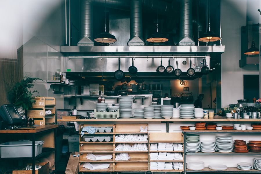 Clean and organized stainless steel restaurant kitchen preparation area