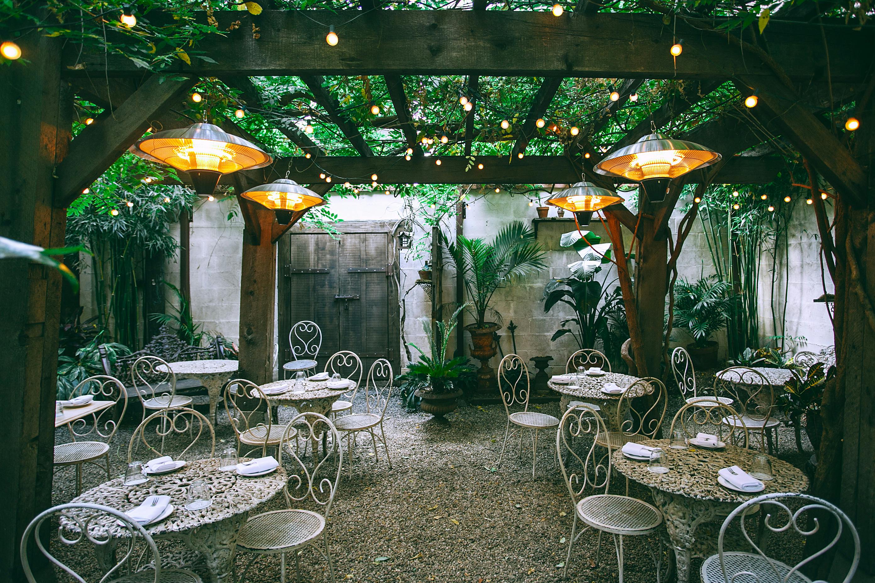 restaurant with served banquet tables in patio