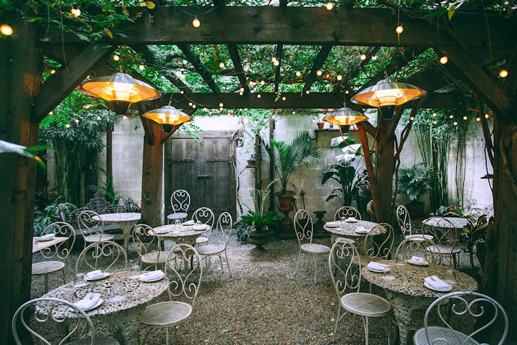 Restaurant With Served Banquet Tables In Patio