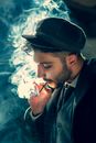 Man Smoking Cigarette Wearing Black Hat