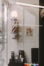 Coffee machine and grinder near glass wall and decoration in form of American and LGBTQ flags in house
