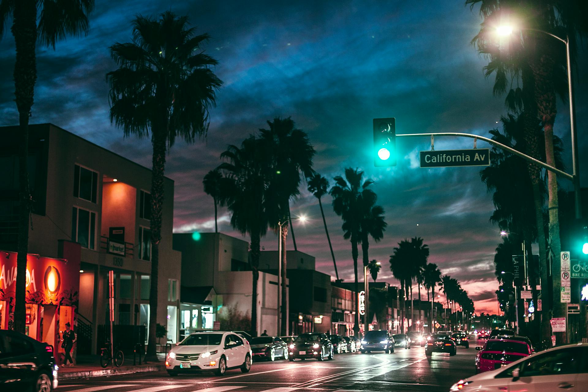 Busy city street in tropical town at night