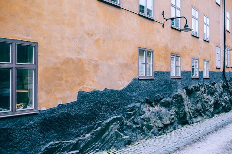 Wall Of Old Building Decorated With Black Relief