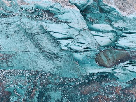 Close-up of a unique textured rock formation in Schitu, featuring vibrant blue hues and intricate details.