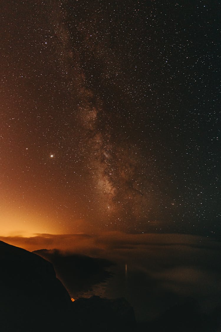 Bright Starry Sky Above Mountains In Darkness