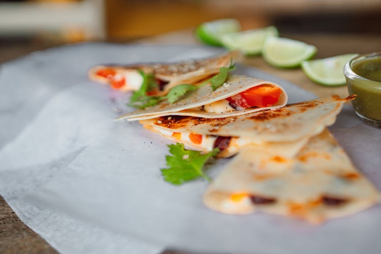 Tortilla Wrap With Sliced Tomato And Green Leaves 