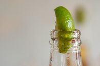 Sliced Lime in Clear Glass Bottle