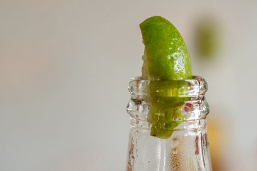 Sliced Lime in Clear Glass Bottle