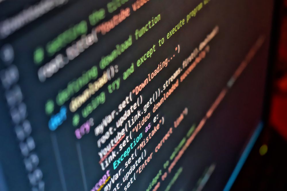 Website code displayed on a monitor