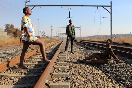 People Posing on Railway Track 