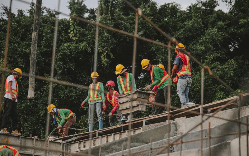 Construction crew working on a commercial roof