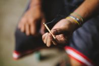 Person Holding a Cigarillo
