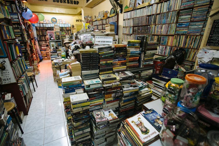 Piles Of Books In A Bookstore