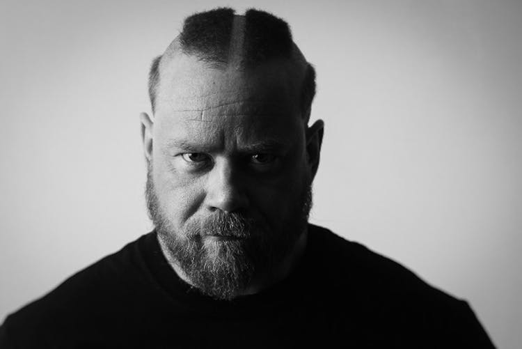 Bearded Man In Black T-Shirt With Shaved Hair