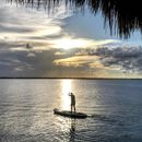 Silhouette of Person Riding a Sap Board