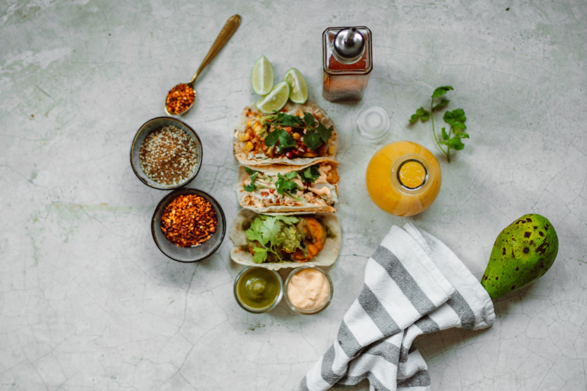 Top view of appetizing Mexican tacos with fresh ingredients, perfect for food photography.