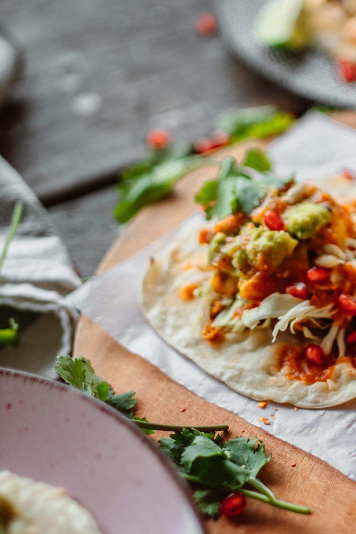 High-protein chicken burrito bowl with rice, beans, corn, peppers and avocado in a white bowl