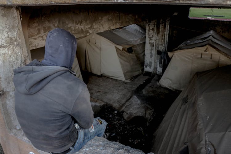 Unrecognizable Man In Abandoned Basement