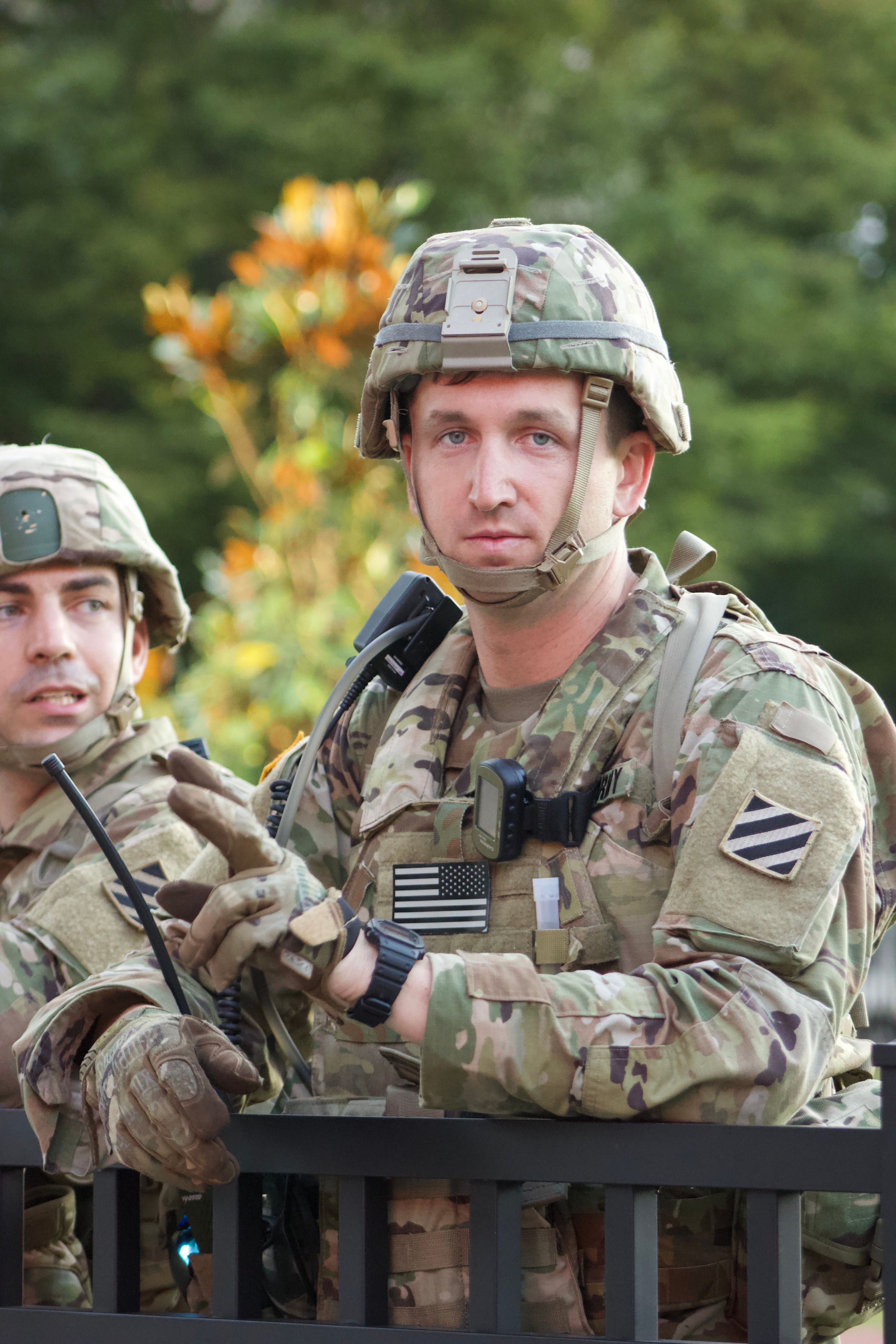 A Man Wearing Camouflage Military Uniform · Free Stock Photo