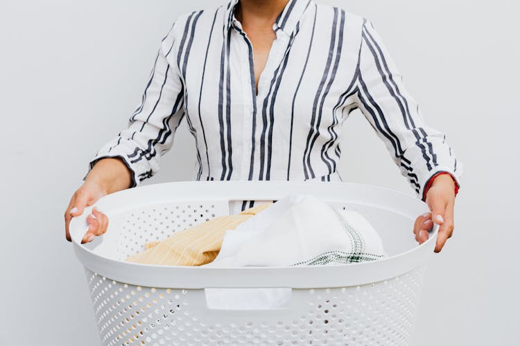 Woman Holding Laundry Basket 