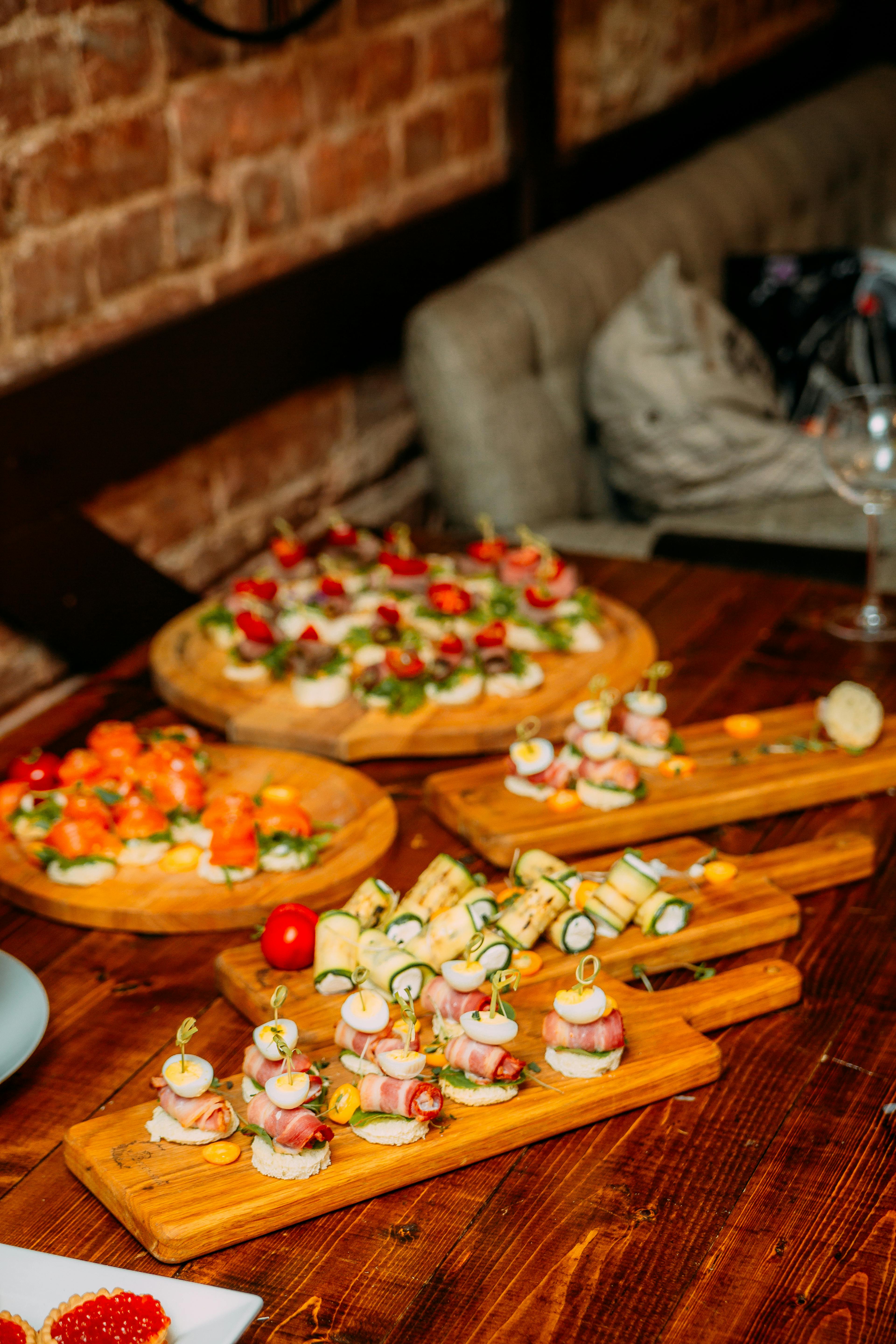 Delicious appetizers on wooden board in cafe