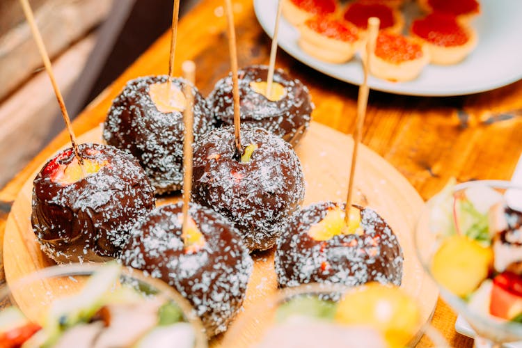 Tasty Chocolate Dessert On Wooden Stick On Table