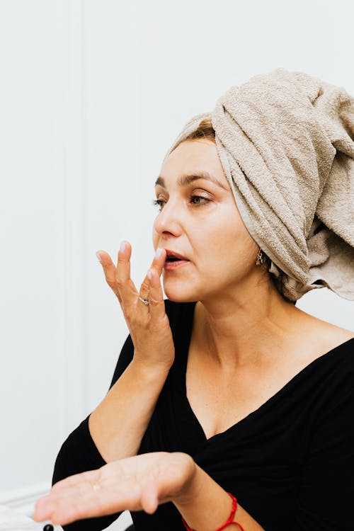 A Woman Applying Makeup