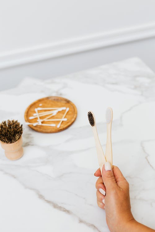 Bamboo Toothbrushes in Hand