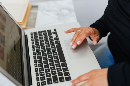 Free Close-up of hands typing on a laptop, ideal for tech and lifestyle themes. Stock Photo