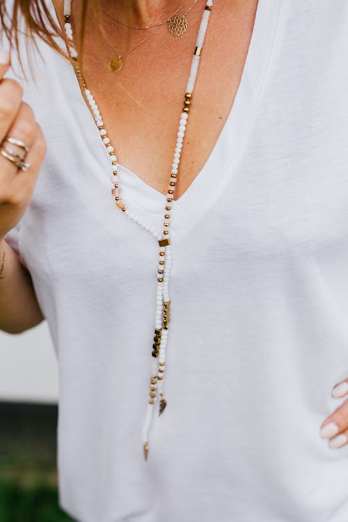 Free Close-up of Woman Wearing Jewelry Necklace Stock Photo