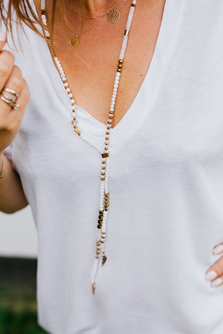 Close-up Of Woman Wearing Jewelry Necklace