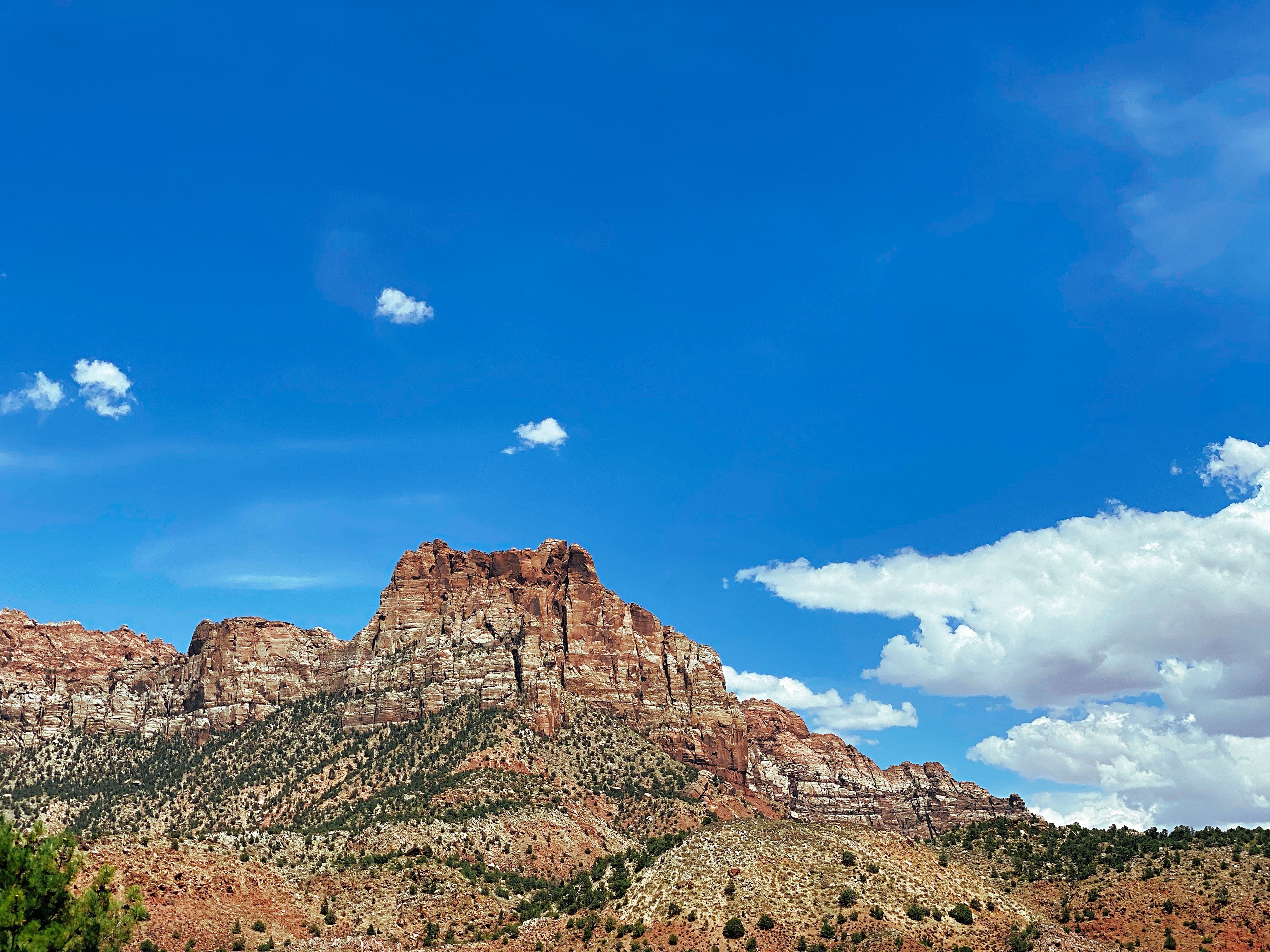Brown Rocky Mountain Under the Blue Sky · Free Stock Photo