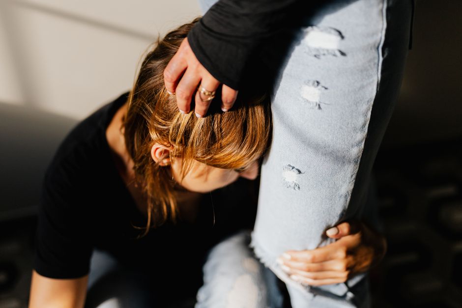 Emotional support between two women captured in a candid moment, highlighting intimacy and empathy.