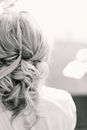 Black and white of young female with middle length hair set in elegant hairstyle