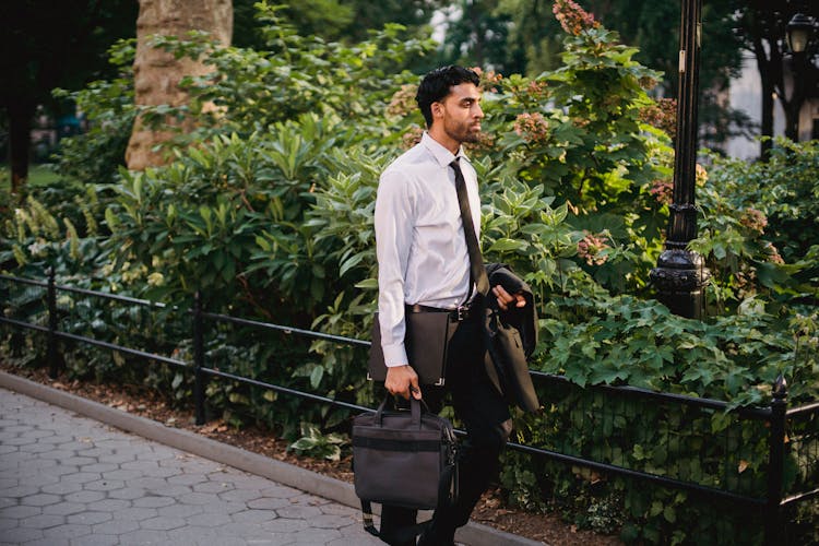 Photo Of A Man Holding A Bag