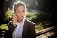 Woman in Suit Talking on the Phone 