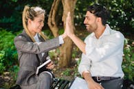 Man and Woman in High Five Gesture 