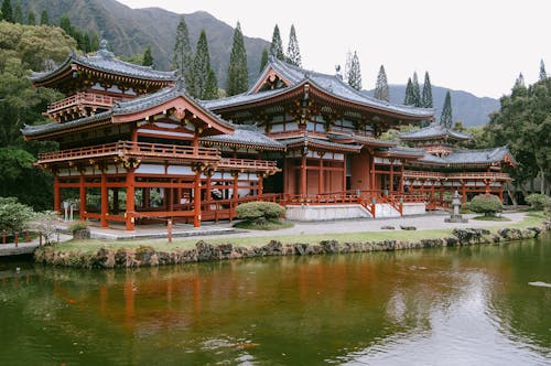 Free Brown and White Temple Near Body of Water Stock Photo