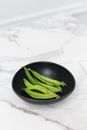 Green Vegetable on Black Ceramic Bowl