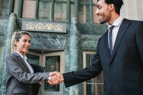 Business People Meeting Outdoors Shaking Hands